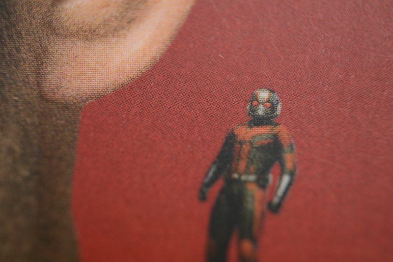 Close-up shot of Ant-Man on Scott Lang's shoulder on the cover of the book Look Out For the Little Guy