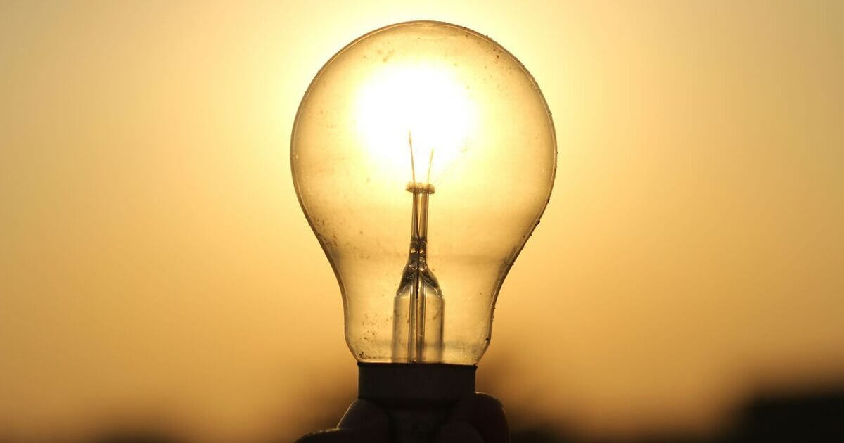 A pale sunset shining through a lightbulb